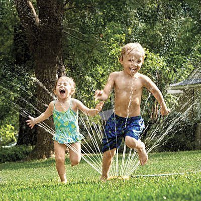 kids playing with sprinkler